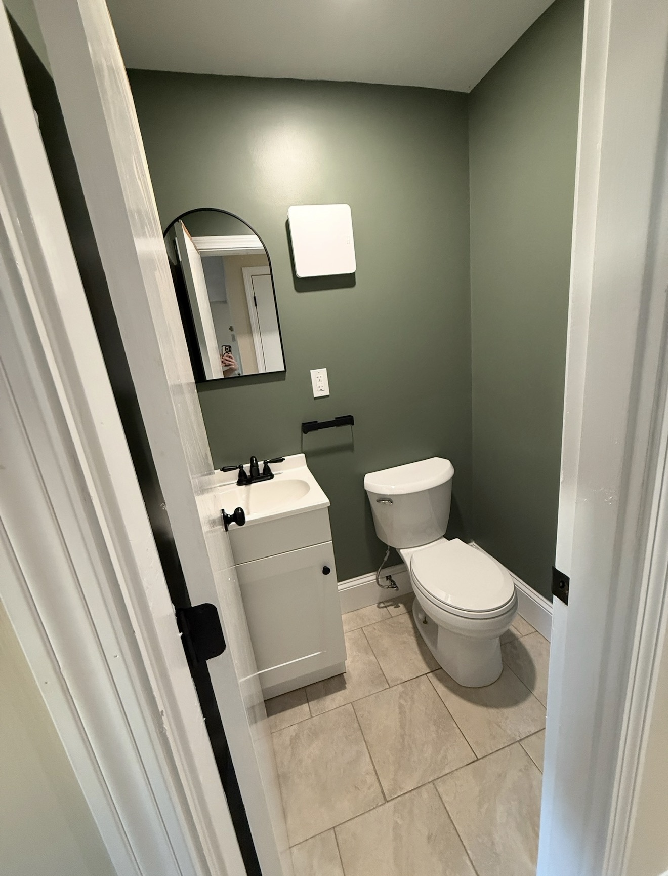 Stoneham bathroom — half bath with sage green walls