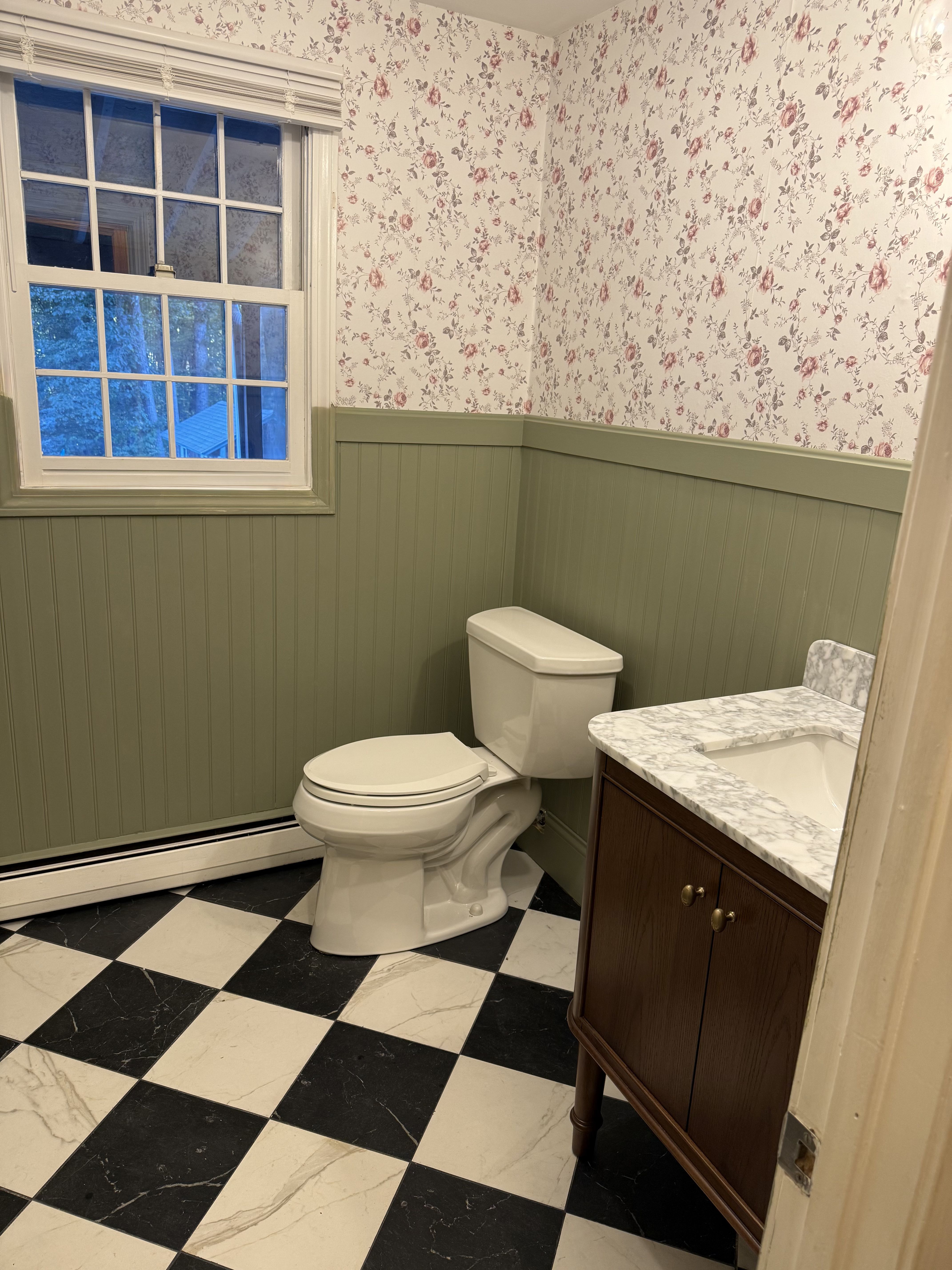 Andover bathroom — green beadboard wainscoting and floral wallpaper