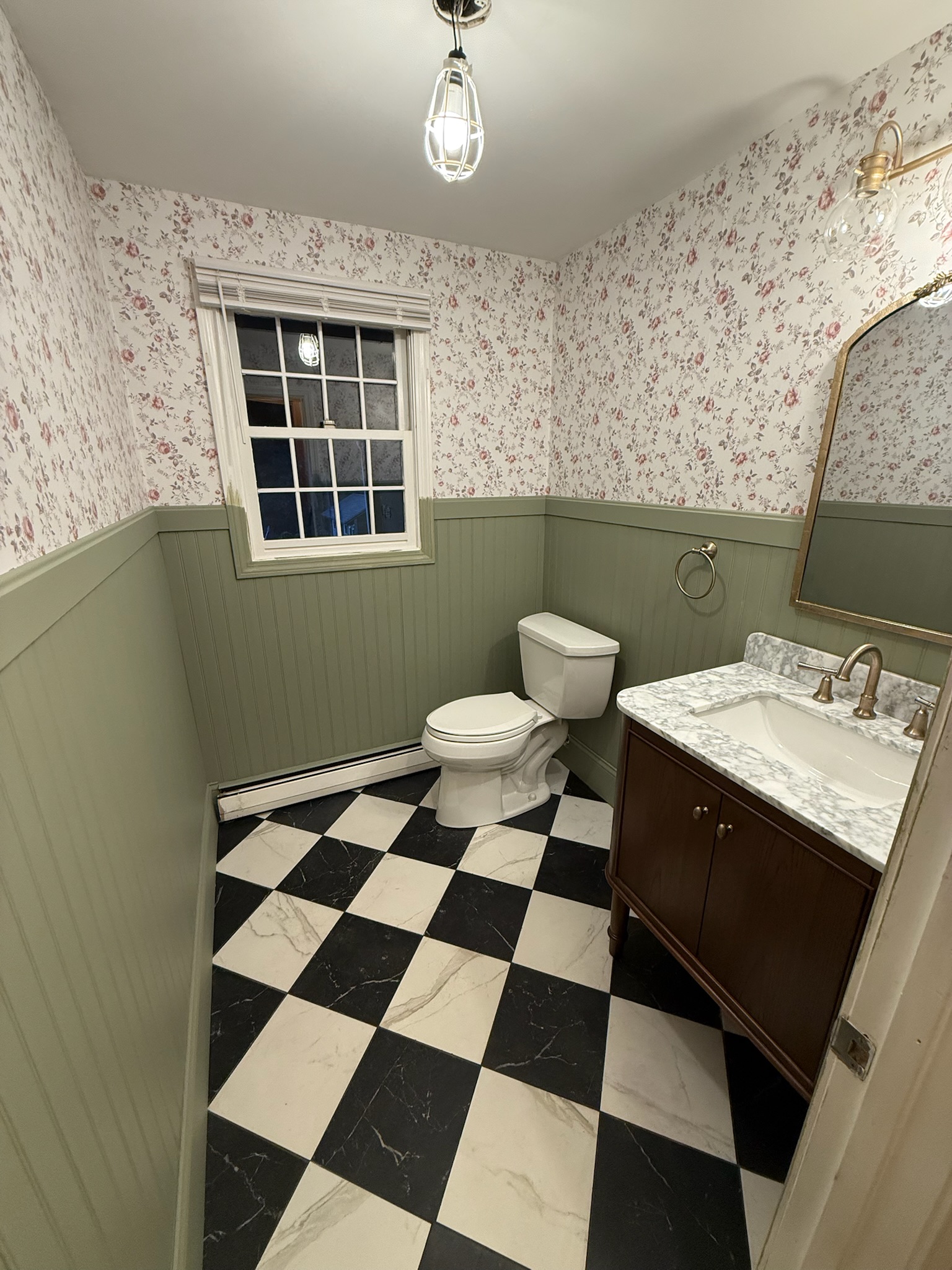 Andover bathroom renovation — full room with floral wallpaper and checkered tile