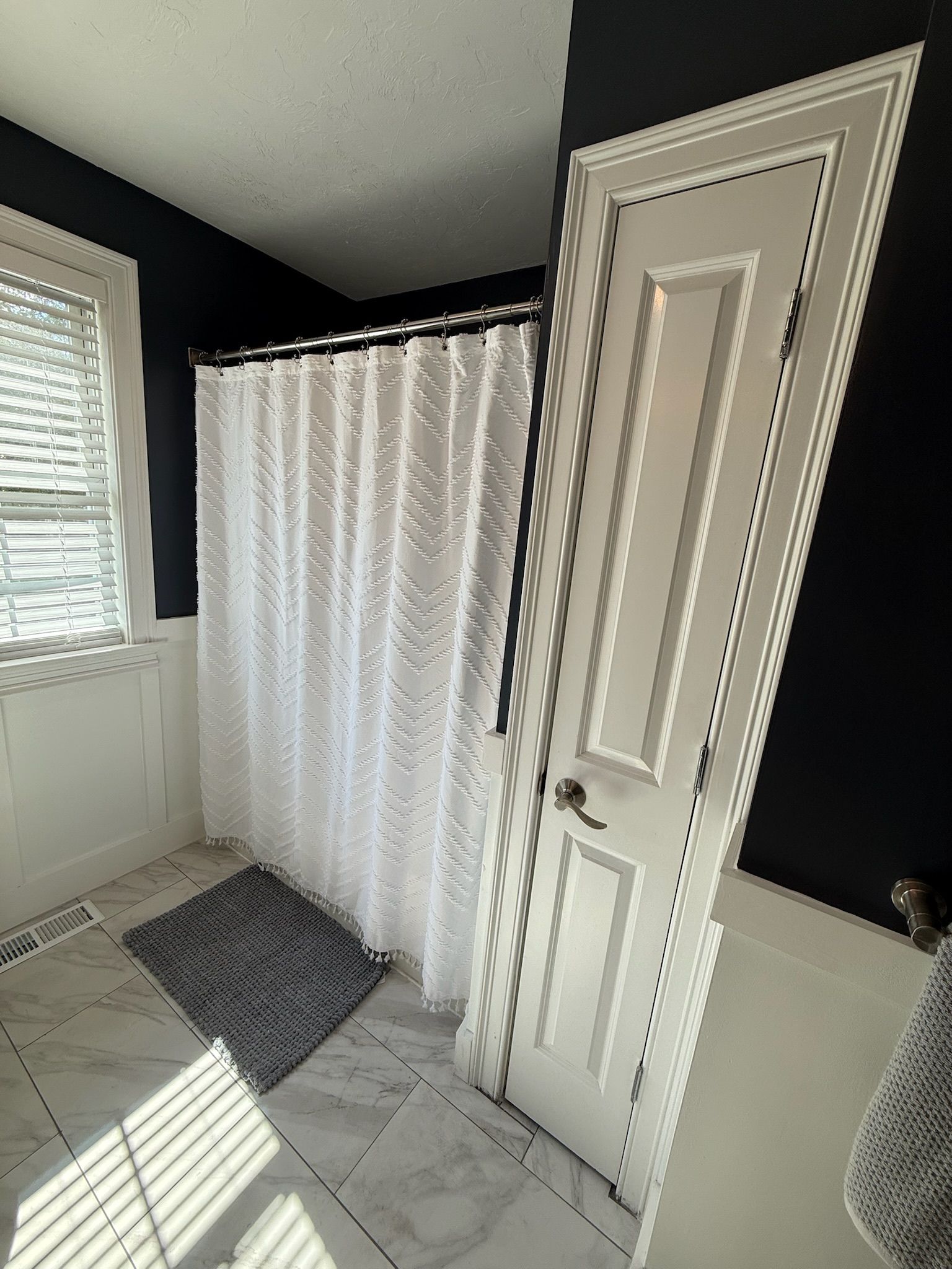 Tewksbury bathroom — shower curtain and door area